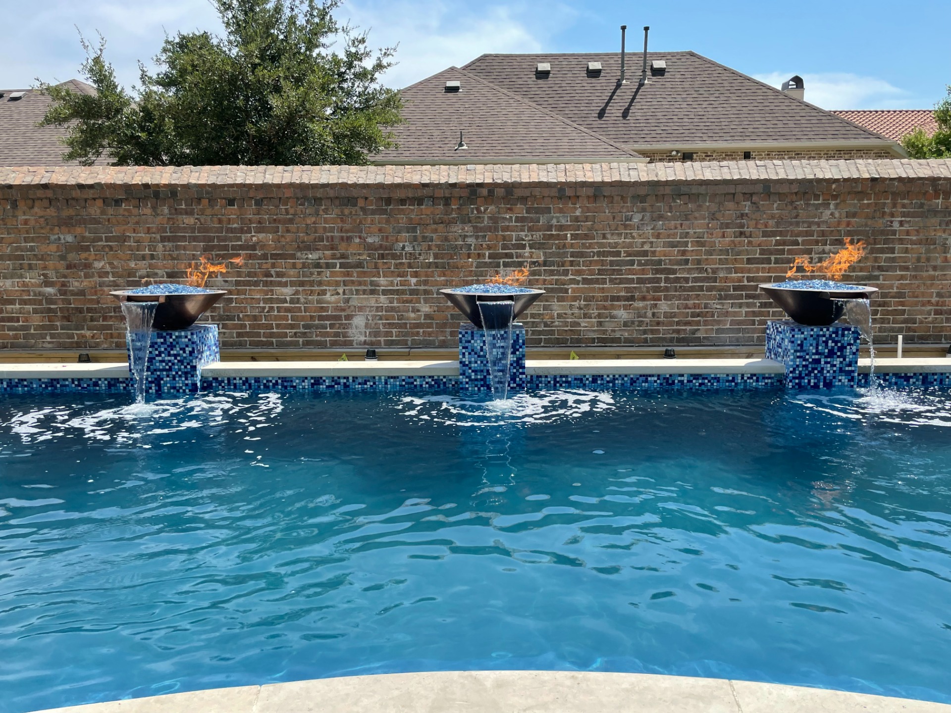 The Outdoor Plus Cazo Fire & Water Bowls with Custom Blend of Diamond Fire Glass on custom Bisazza mosaic pedestals inspired from Caesar's Palace in Las Vegas. 