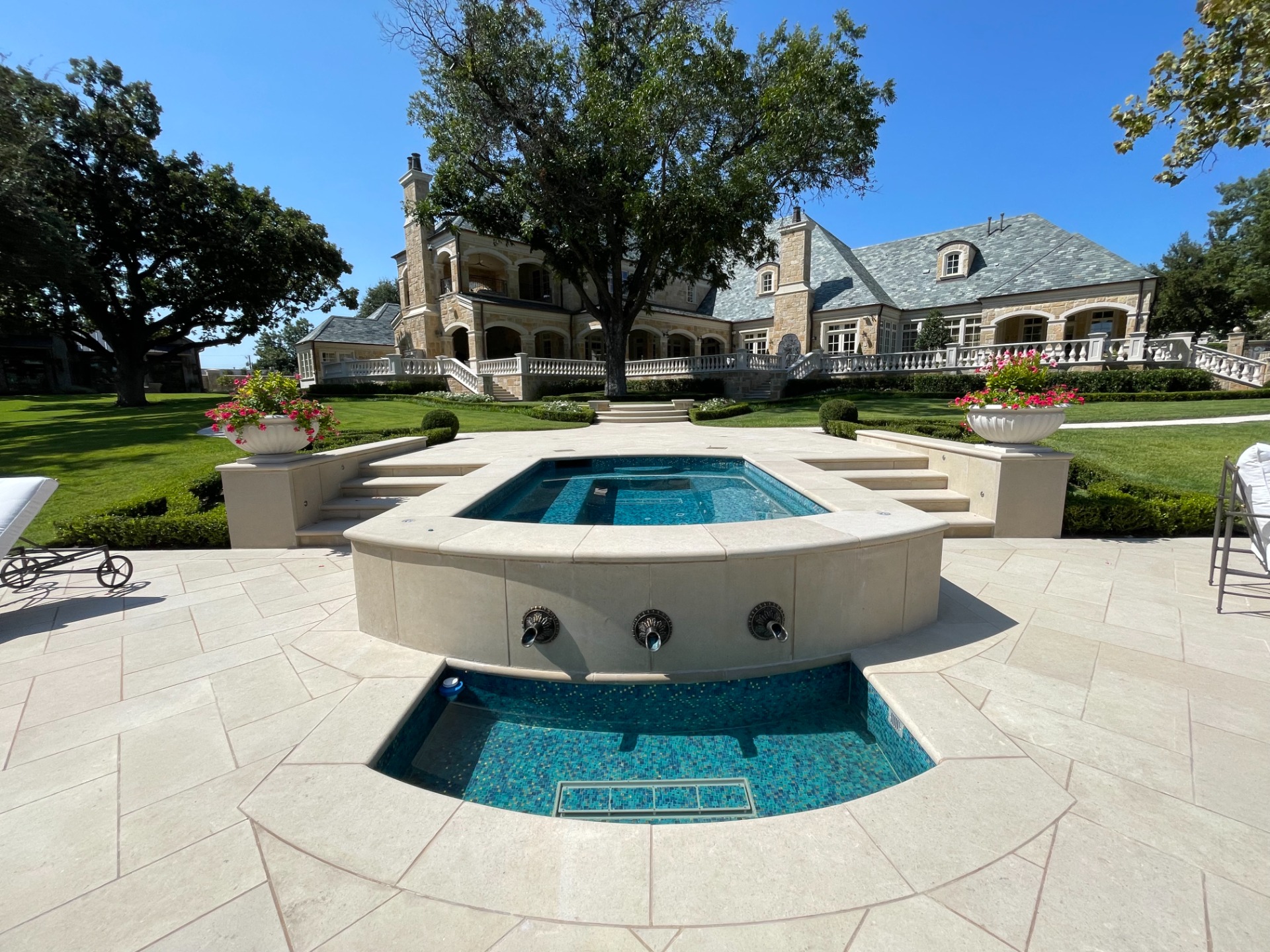 Custom therapy spa with dedicated pumps on two captain seats, Crystal Fountains deck jets, Bronze sconces, and custom Bisazza mosaic tile interior with blue, green, and gold.
